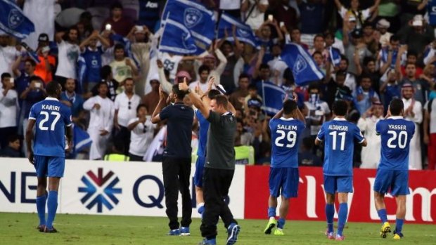 Saudi Al-Hilal players celebrate with their fans after defeating UAE's Al-Ain.