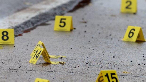 Dozens of shell casings lay on the ground at the scene of an overnight shooting in Bristol, Tennessee.