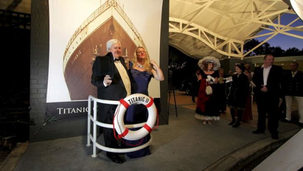 Clive Palmer poses with guests at the Captain's Atlantic Dinner as part of the week-long Titanic Culinary Journey at the Palmer Coolum Resort last year.
