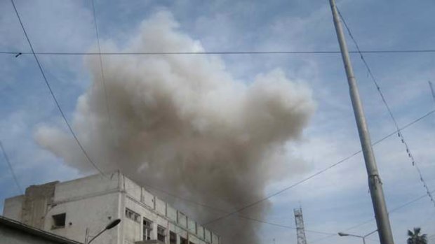 Smoke rises from a bank in Jalalabad, east of Kabul, Afghanistan.