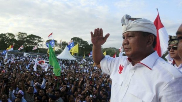 Indonesian presidential candidate Prabowo Subianto greets his supporters during his election campaign rally in Bali on Sunday. Indonesia will hold its presidential poll on July 9.
