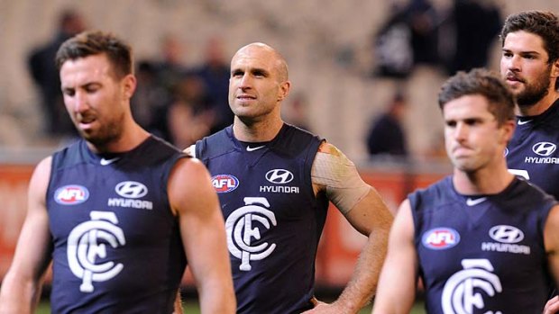 Carlton's Brock McLean Chris Judd, Marc Murphy and Levi Casboult after the loss to Collingwood at the MCG in round 15.