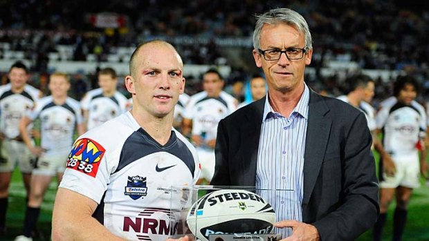 Darren Lockyer of the Broncos poses with NRL chief executive David Gallop after playing his 350th match, against the North Queensland Cowboys, in Townsville on Friday.