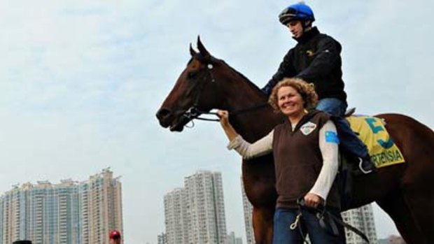 Ortensia steps out for work at the Sha Tin track with jockey Jake Noonan and strapper Lisa Jones last month.