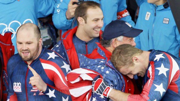 Geoff Bodine is embraced by Curtis Tomasevicz after the US team won gold.