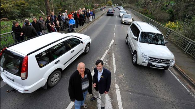 Warrandyte residents protest against proposed planning changes at the only bridge out of the area in the event of a bushfire.