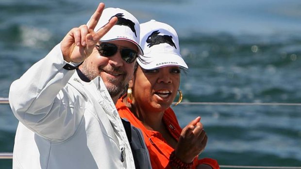 Fans in team garb ... Russell Crowe and Oprah Winfrey.