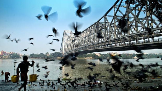 On the move ... Howrah Bridge and the Hooghly River.