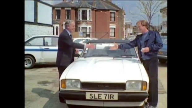 George Cole (Arthur Daley) and Dennis Waterman (Terry McCann) in the famous opening scene from <i>Minder</i>.