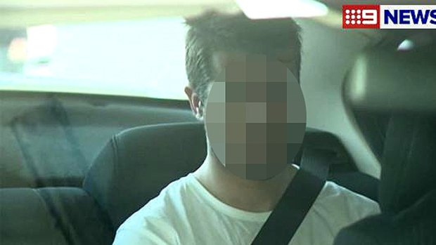 Gable Tostee is driven to Southport Watchhouse after his arrest.