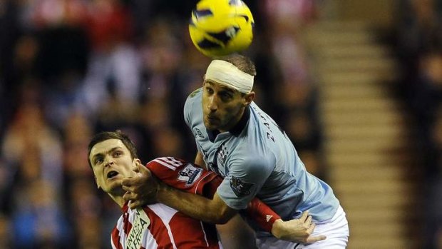 Manchester City's Pablo Zabaleta challenges Sunderland's Adam Johnson.