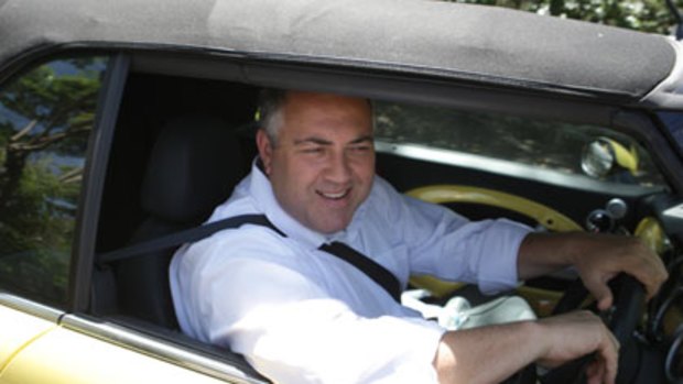 Man on the move  ... Joe Hockey arrives at his north shore home yesterday after a tumultuous week in Canberra.