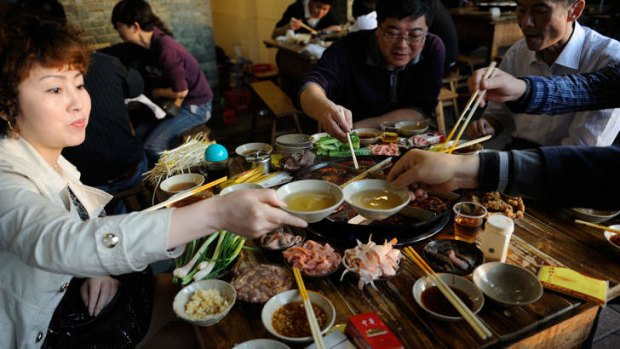 Local diners enjoy hot-pot.