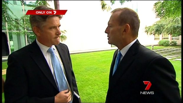 A dramatic pause: Tony Abbott nods at Mark Riley. 