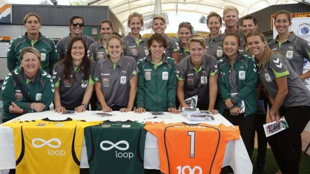 Part of the 2013/14 Canberra United team during the team launch.