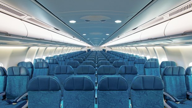 A front-to-back view of the main cabin on Hawaiian Airlines.