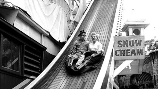 An Australian soldier and female friend on Luna Park’s Jack and Jill slide in 1954.
