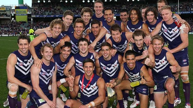 The Dockers pose with the Western Derby Trophy after winning the round 19 AFL match between the Fremantle Dockers and the West Coast Eagles at Patersons Stadium on August 4, 2012 in Perth, Australia.