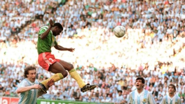 Forward Francois Omam-Biyick from Cameroon scores on a header against Argentina in 1990.