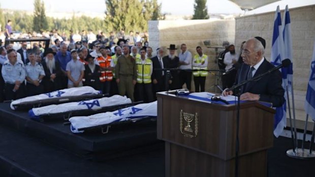 Israeli President Shimon Peres, right, eulogises the three Israeli teens who were abducted and killed in the occupied West Bank.