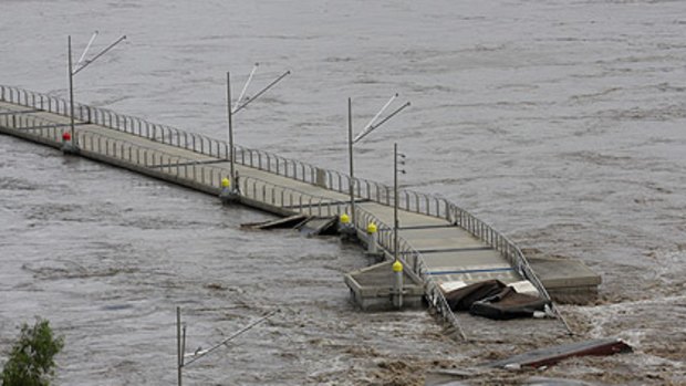 The floating Riverwalk becomes a victim of last month's flood.