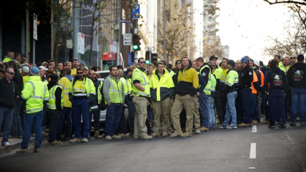 Workers from the desalination plant gather outside Fair Work Australia in Melbourne earlier this year.