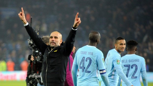 Winning run continues: Manchester City boss Pep Guardiola celebrates.