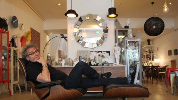 Battle of the names ... retailer Adam Drexler and a replica Eames lounge chair and ottoman in his Matt Blatt store in Paddington.