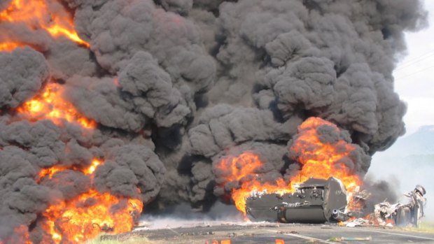A fuel tanker bursts into flames near Mackay, Queensland, in 2004. Large freight companies are leaving it too late to train their people how to deal with such emergencies.
