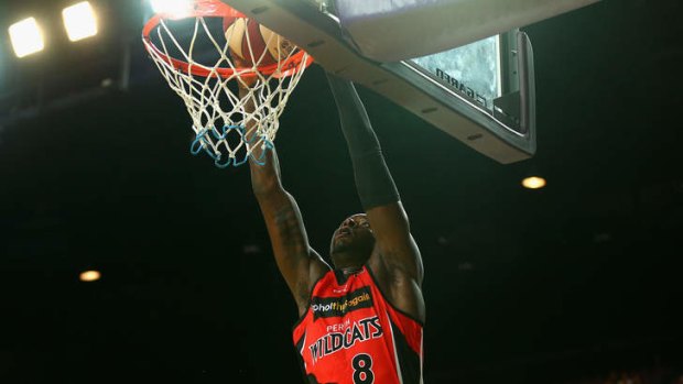 James Ennis slam dunks during the round three NBL match between the Sydney Kings and the Perth Wildcats.