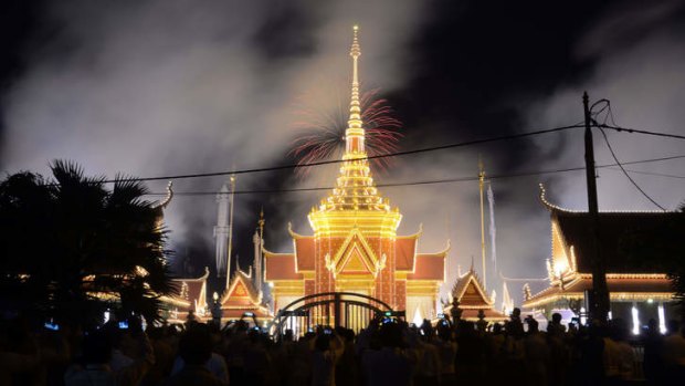 Smoke rises from the crematorium at the beginning of what may have been the last traditional ceremony to farewell a Cambodian monarch.