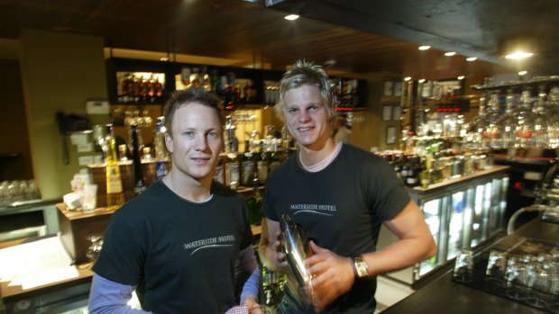 Footballers and publicans Nathan Brown and Nick  Riewoldt behind the bar at The Waterside Hotel, 