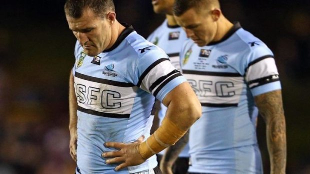 Paul Gallen and Todd Carney feel the pain on Sunday.