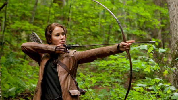 Hungry for more ... Jennifer Lawrence stars in the Hunger Games movie - but readers also continue to buy printed copies of Suzanne Collins's trilogy.