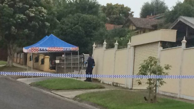 Police at the Moonee Ponds crime scene on Monday morning.