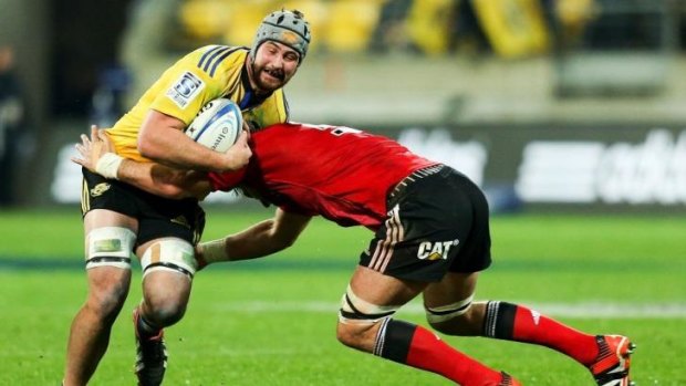 Blade Thomson tries to make a break for the Hurricanes against the Crusaders.