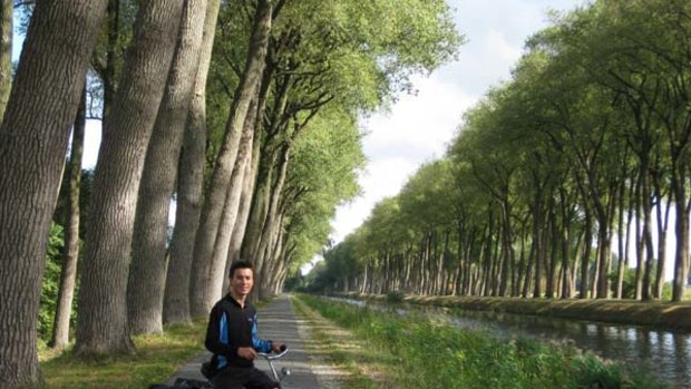 Made for two wheels ... Stuart Wilson takes a breather on a bike path north of Brugge.