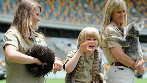 Robert Irwin with sister Bindi and mother Terri at the Gabba earlier this year.