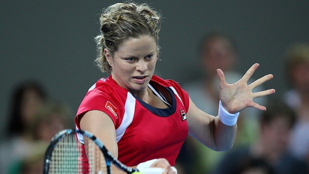 Kim Clijsters plays a forehand against Iveta Benesova of the Czech Republic during day five of the 2012 Brisbane International.