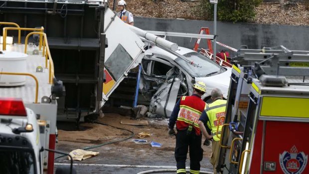 A car is stuck under the truck in Sydney's north.