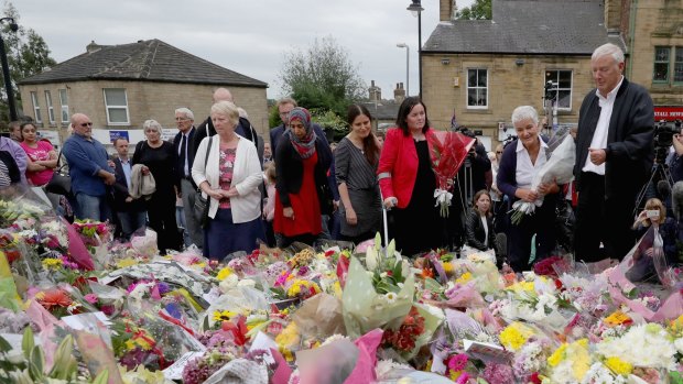 Gordon and Jean Leadbeater, the parents of Labour MP Jo Cox, are joined by family members and friends during their visit to see the floral tributes to their daughter in Market Square, Birstall. Photo by Christopher Furlong/Getty Images