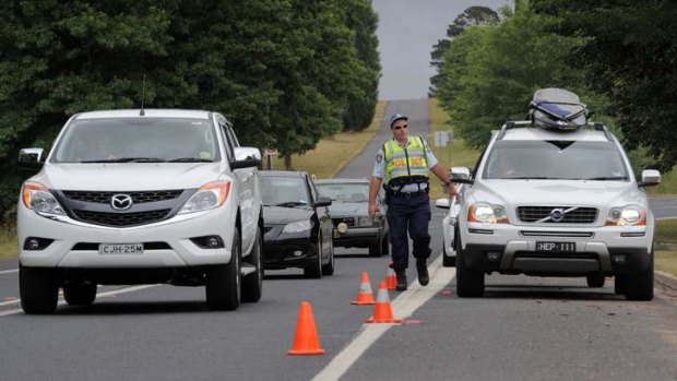 NSW Police conducting random breath tests on motorists entering the township of Braidwood, as the annual exodus to the south coast from Canberra begins.