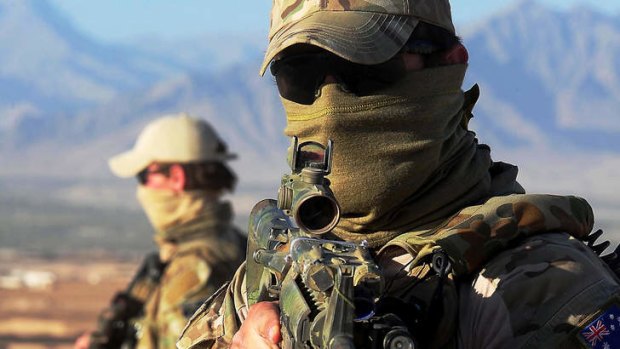 A Special Operations Task Group soldier prior to a mission with the Uruzgan Special Response Team.