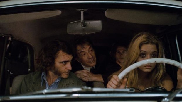 On the case: The already-clouded consciousness of Larry 'Doc' Sportello (Joaquin Phoenix), left, takes a hammering in <i>Inherent Vice</i>.
