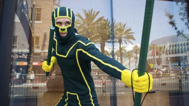 Cosplayer Travis Stapleton as comic book character <i>Kick-Ass</i> during the 2013 San Diego Comic-Con International in California.