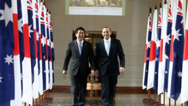 In lockstep: Japanese Prime Minister Shinzo Abe and Prime Minister Tony Abbott leave the House of Representatives after a joint address to parliament.