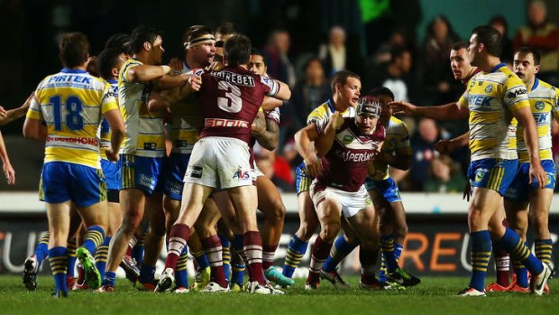 Melee: Eels and Manly players hold back Eels prop Mitchell Allgood.