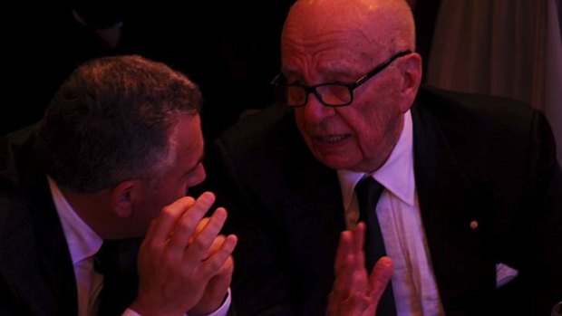 Federal Treasurer Joe Hockey and Rupert Murdoch in conversation.