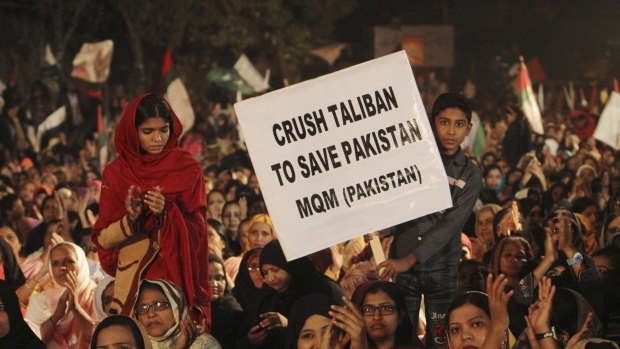 Supporters of Pakistan's MQM political party call for harsh measures against the Taliban at a rally in Karachi on Friday.