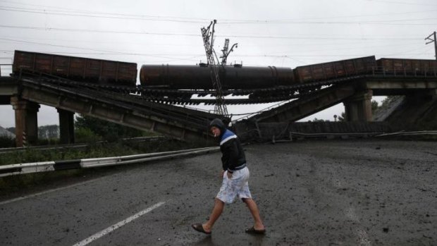 A destroyed railroad bridge on a  road leading to Donetsk.